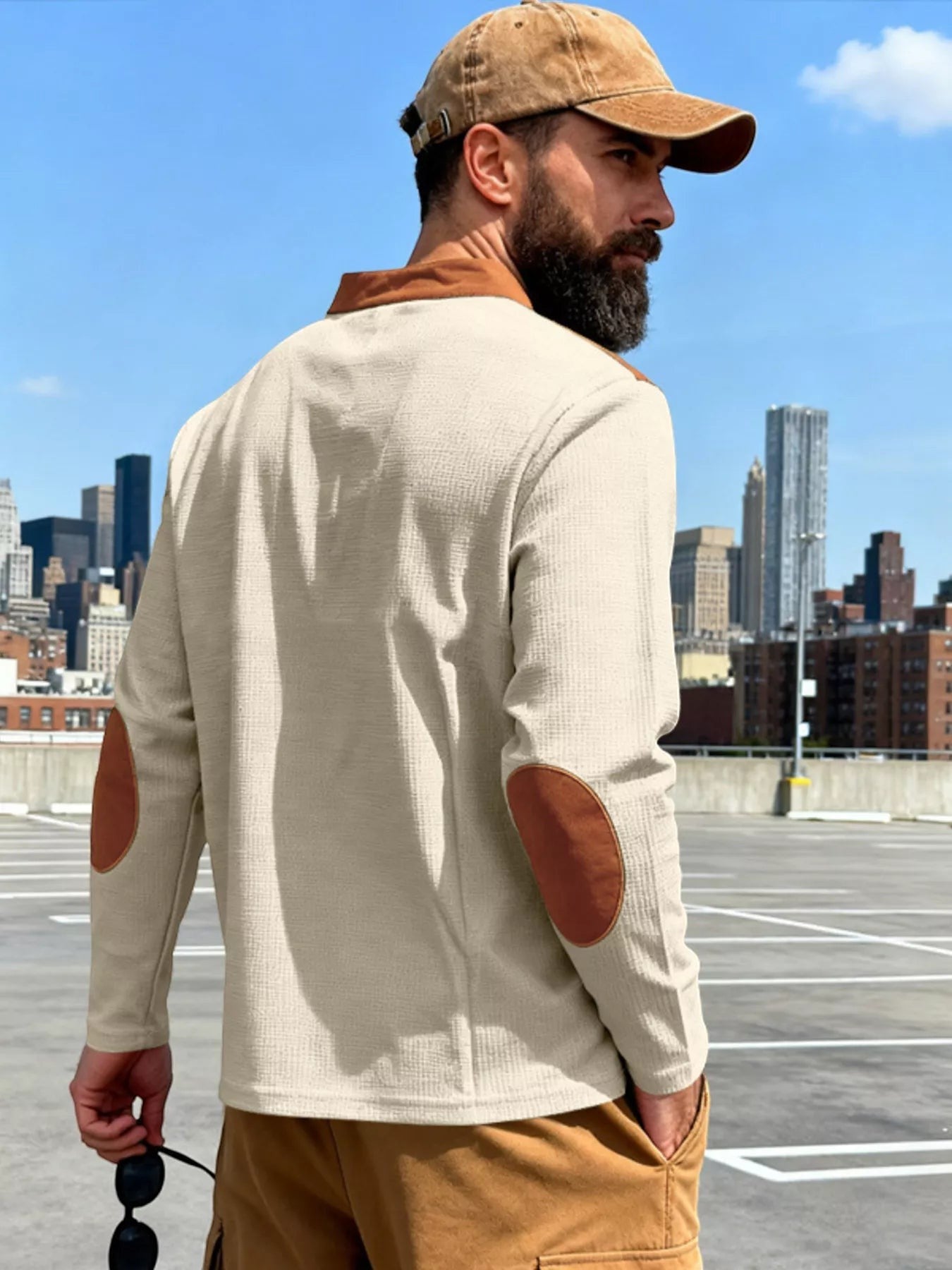 Stylio men's beige long sleeve t-shirt with brown elbow patches and lace-up detail. Cotton-spandex blend.