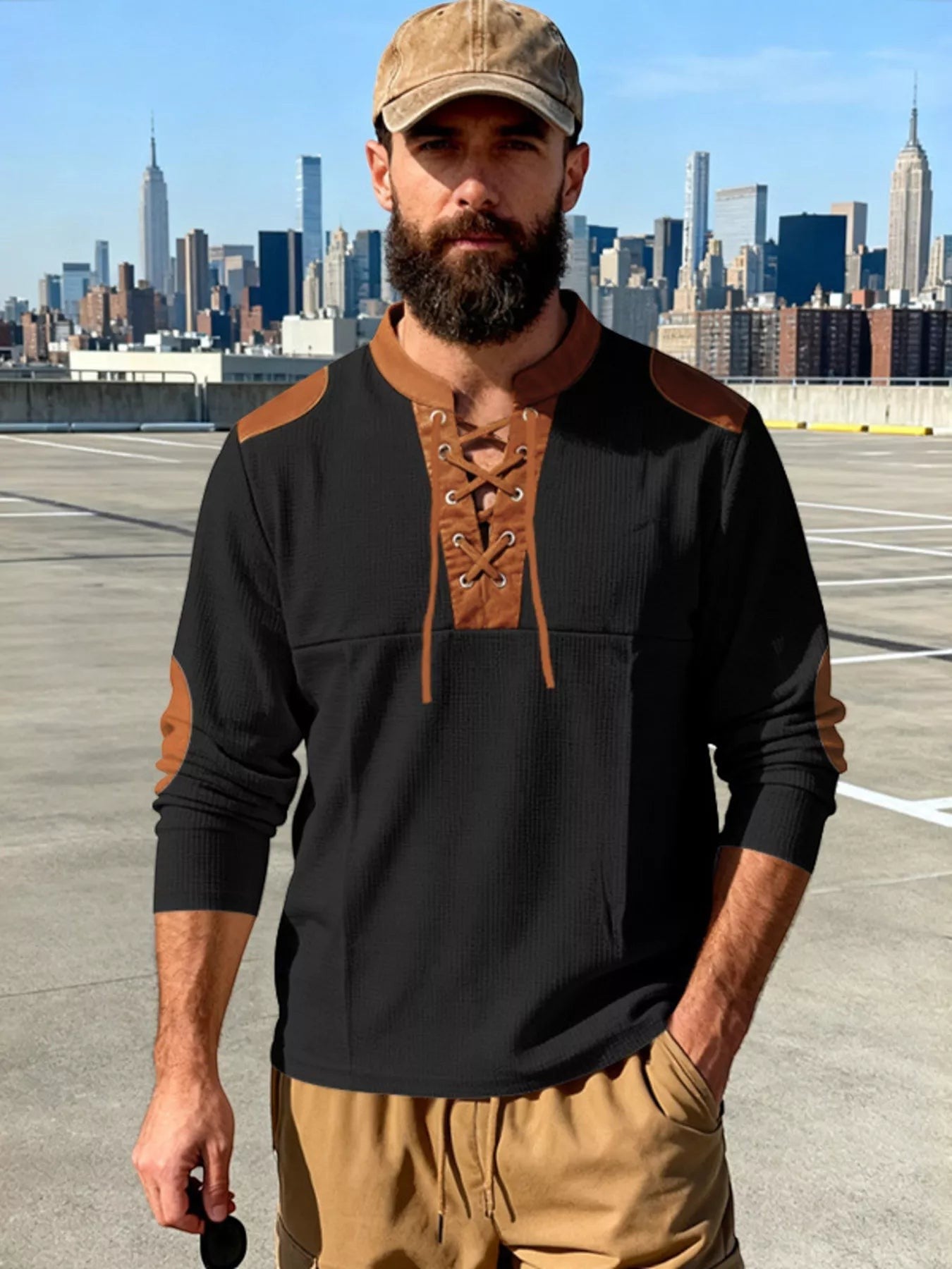 Stylio men's black long sleeve t-shirt with lace-up neckline and brown faux leather accents on shoulders and elbows. Plus size available.