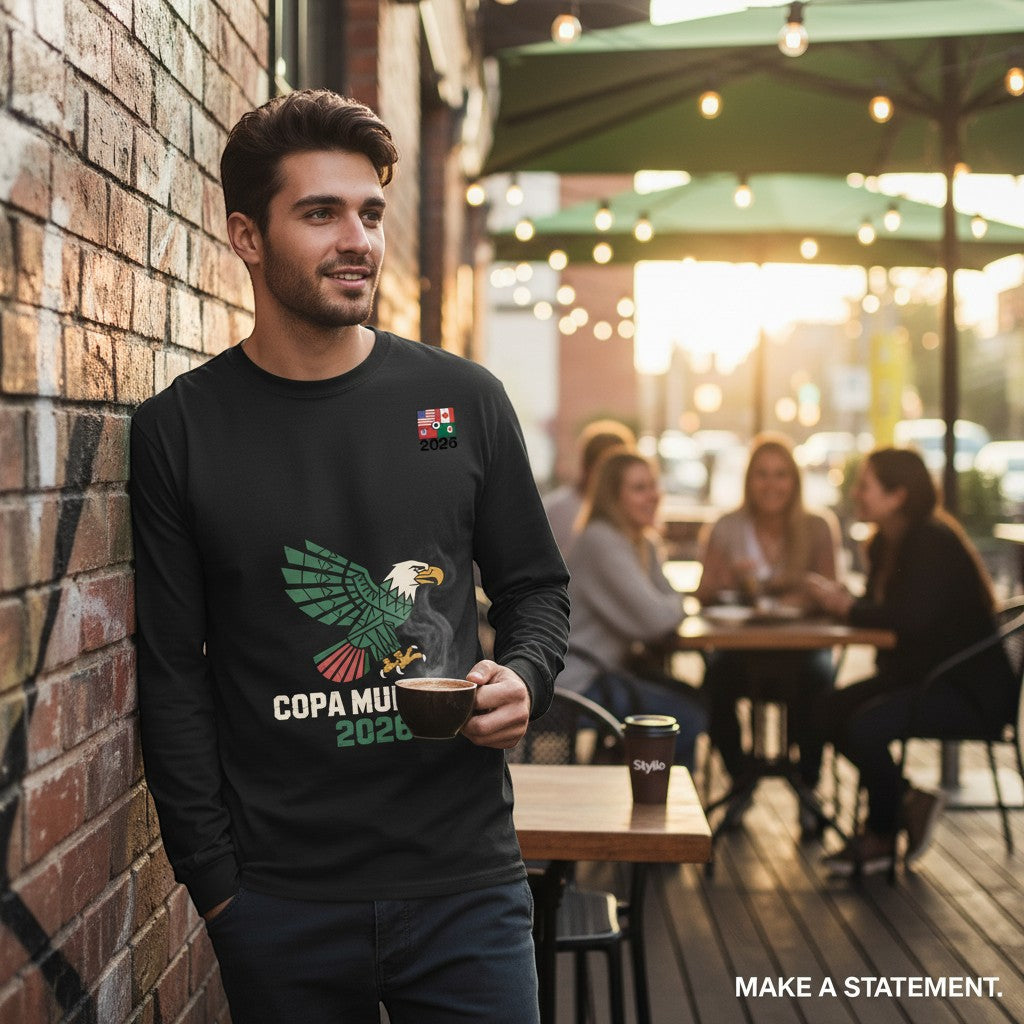 Stylio black 100% cotton long-sleeve t-shirt with eagle graphic and "COPA MU 2026" text. Model is holding a coffee cup.