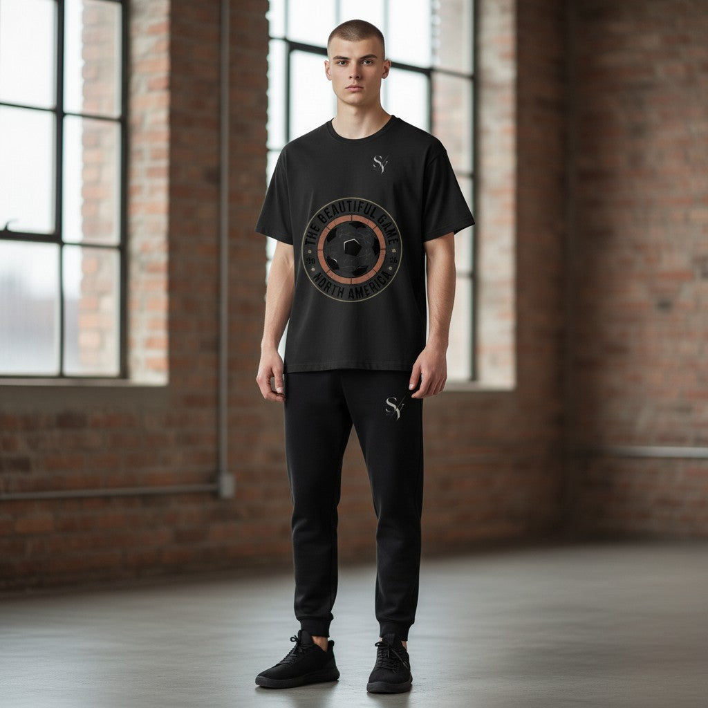 Stylio black polyester t-shirt with a graphic of a soccer ball and text "The Beautiful Game North America" and "20 26".