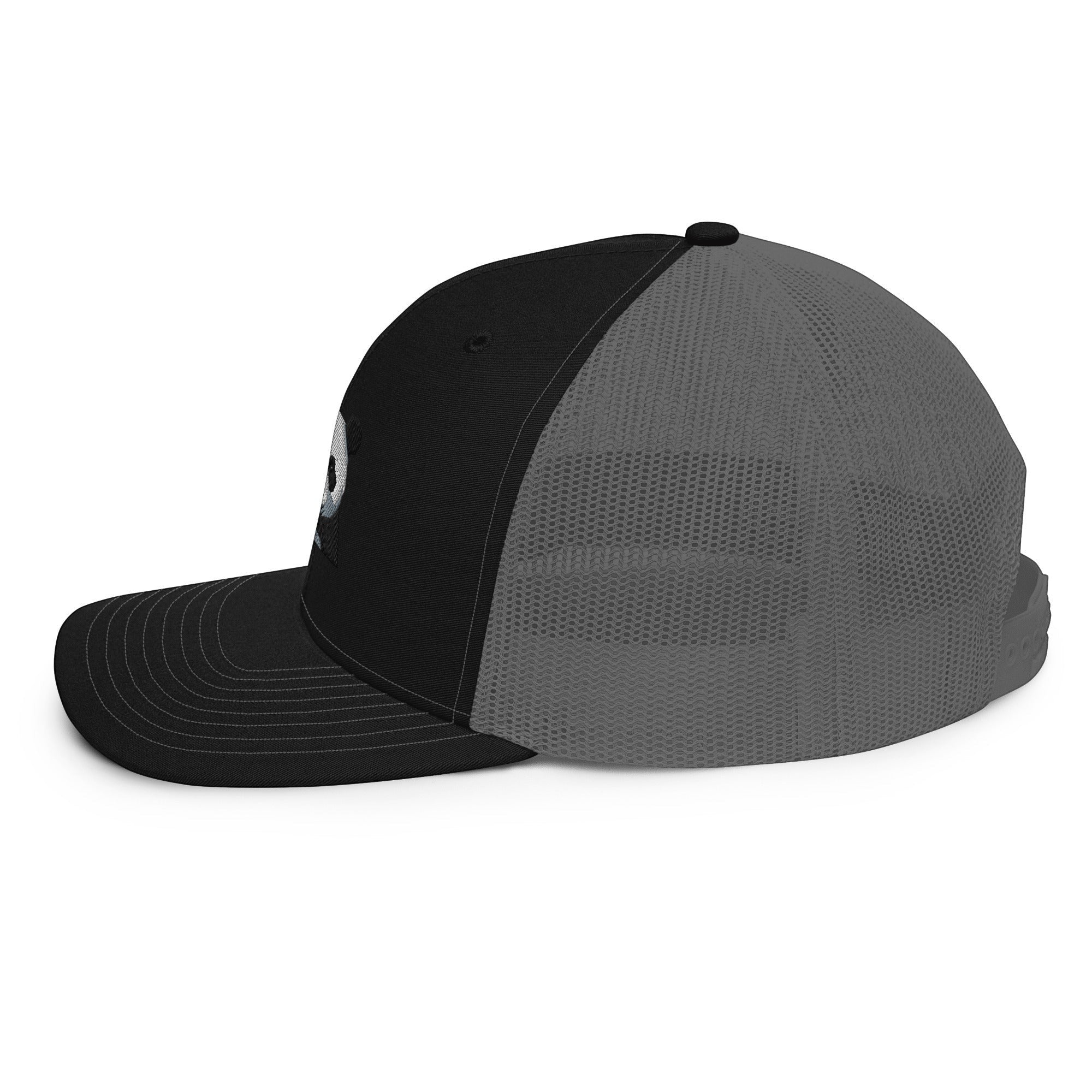 Stylio black trucker cap with grey mesh back and embroidered logo on front panel. Curved visor.