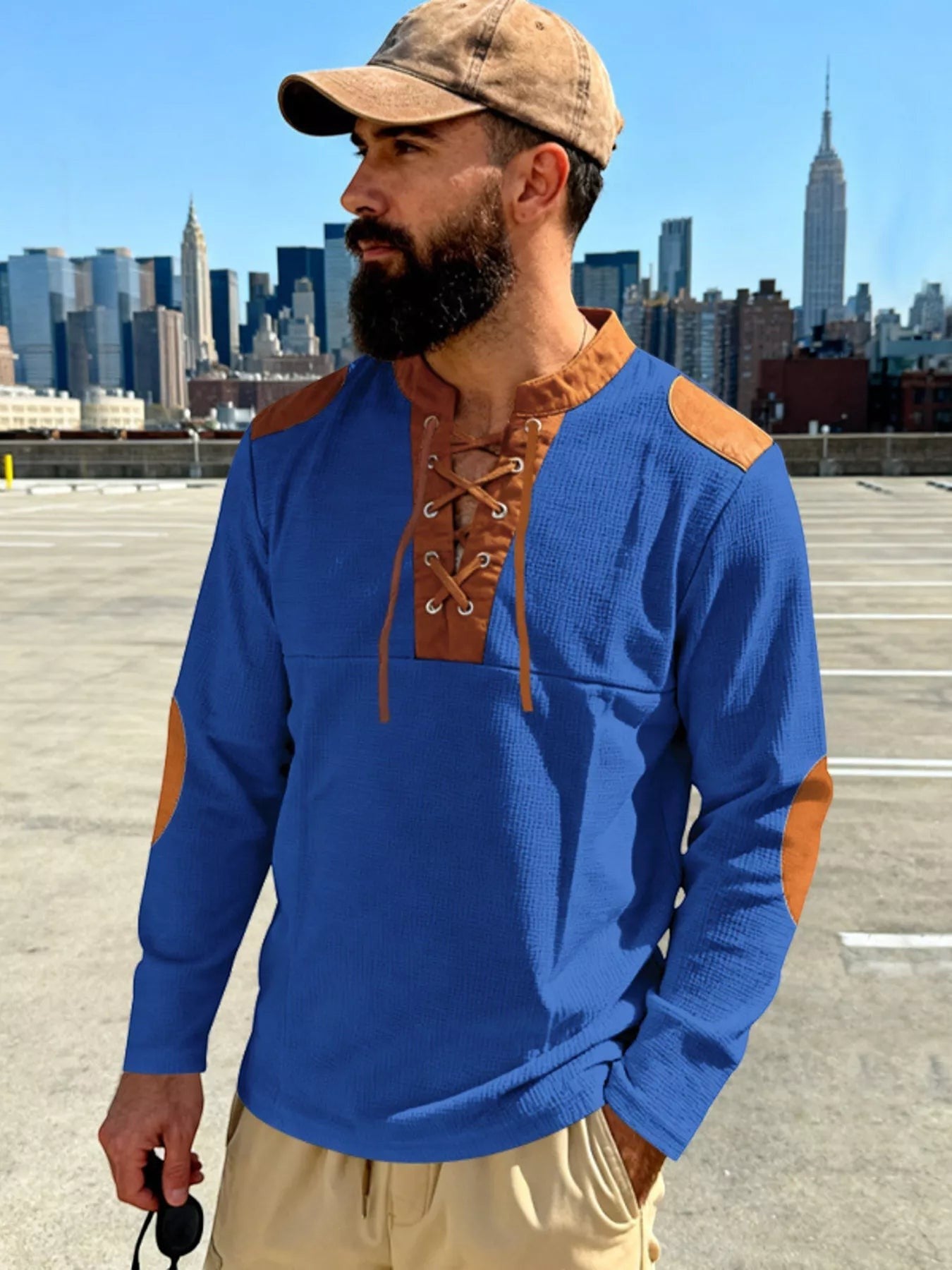 Stylio men's blue long sleeve cotton blend t-shirt with lace-up neckline and brown contrast elbow patches.