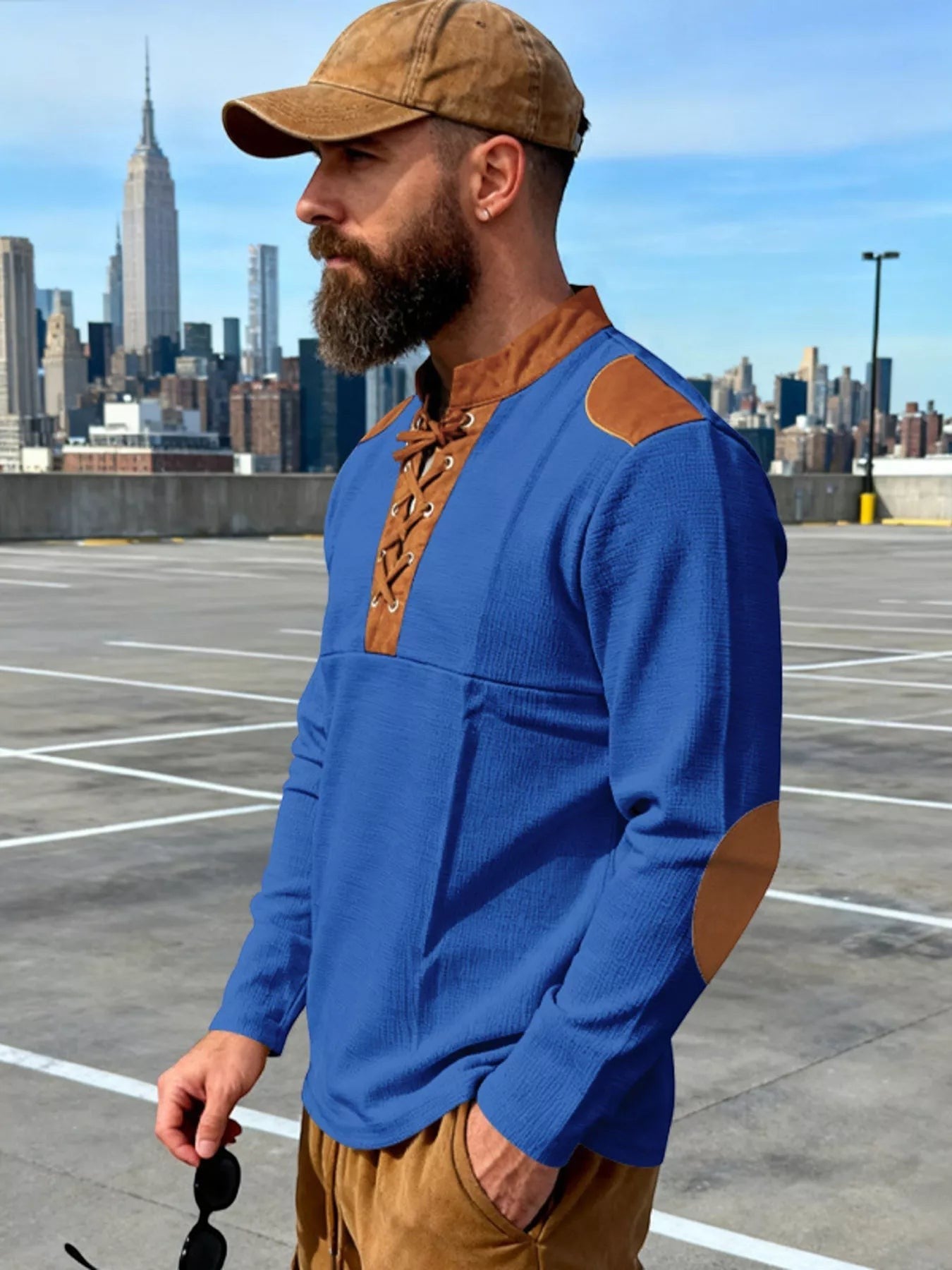 Stylio men's royal blue long sleeve t-shirt with lace-up neckline and brown suede elbow patches. Cotton-spandex blend.