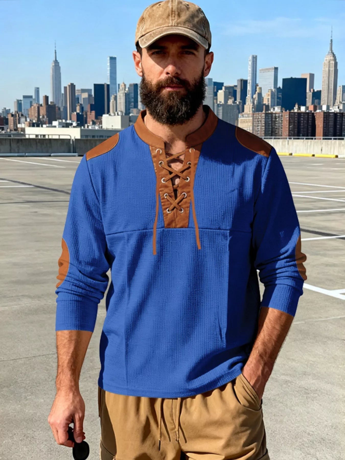 Stylio men's blue waffle knit long sleeve t-shirt with brown lace-up detail and faux leather elbow patches.