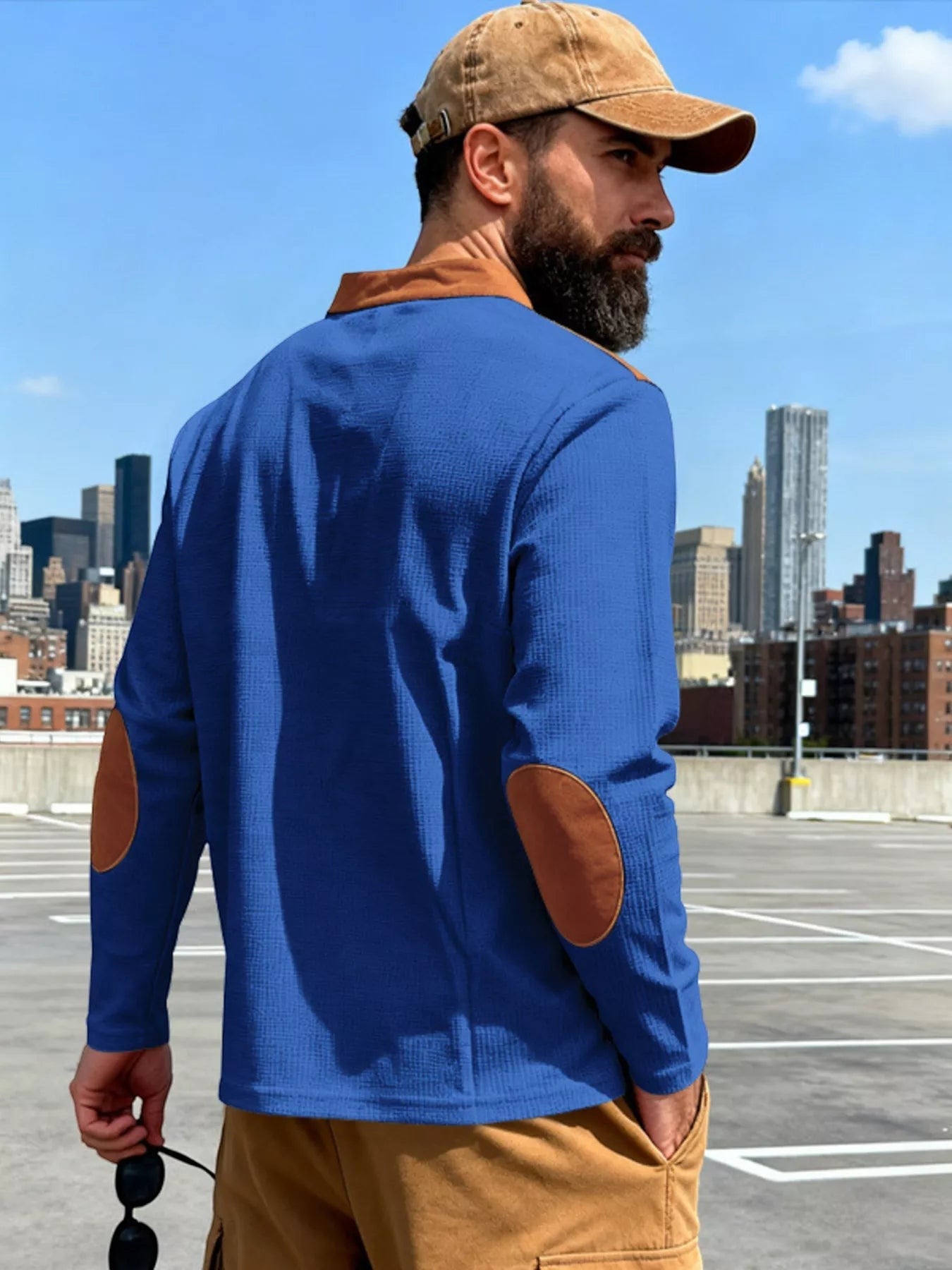 Stylio men's royal blue long sleeve t-shirt with brown elbow patches and collar detail. Cotton-spandex blend.