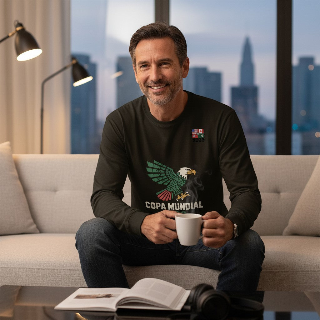Stylio man in a dark long-sleeve t-shirt with a graphic of an eagle and "COPA MUNDIAL" text, sitting on a couch.