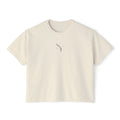 Stylio cream pigment-dyed cotton boxy tee with a subtle grey logo on the chest. Relaxed fit, cropped silhouette.
