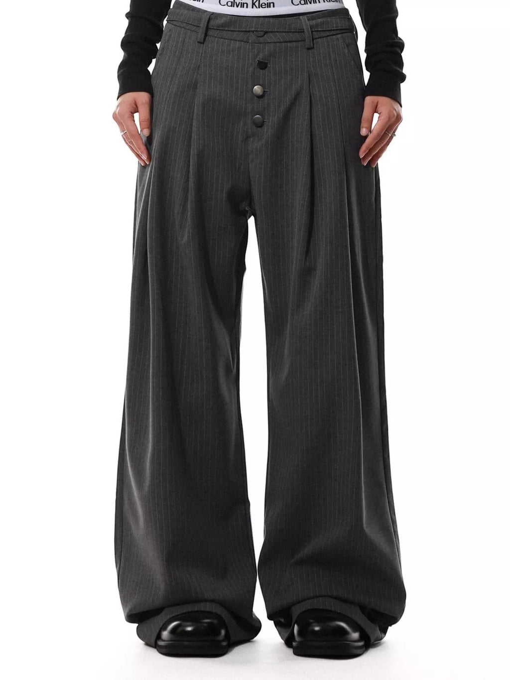 Stylio men's dark grey pinstripe wide-leg pants with button-front closure and pockets. Polyester-spandex blend.