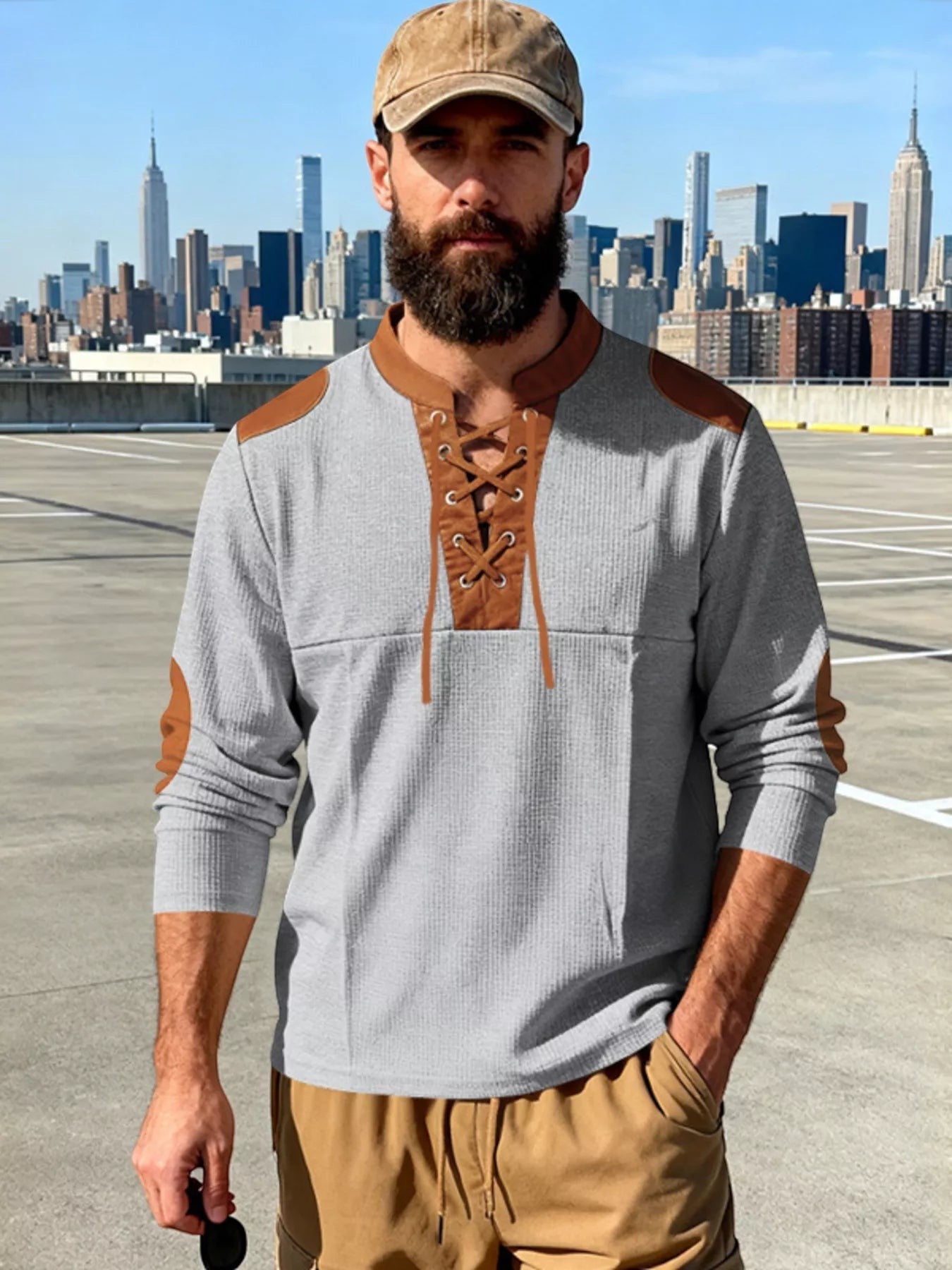 Stylio men's grey waffle knit long sleeve t-shirt with brown lace-up neckline and faux leather shoulder patches.