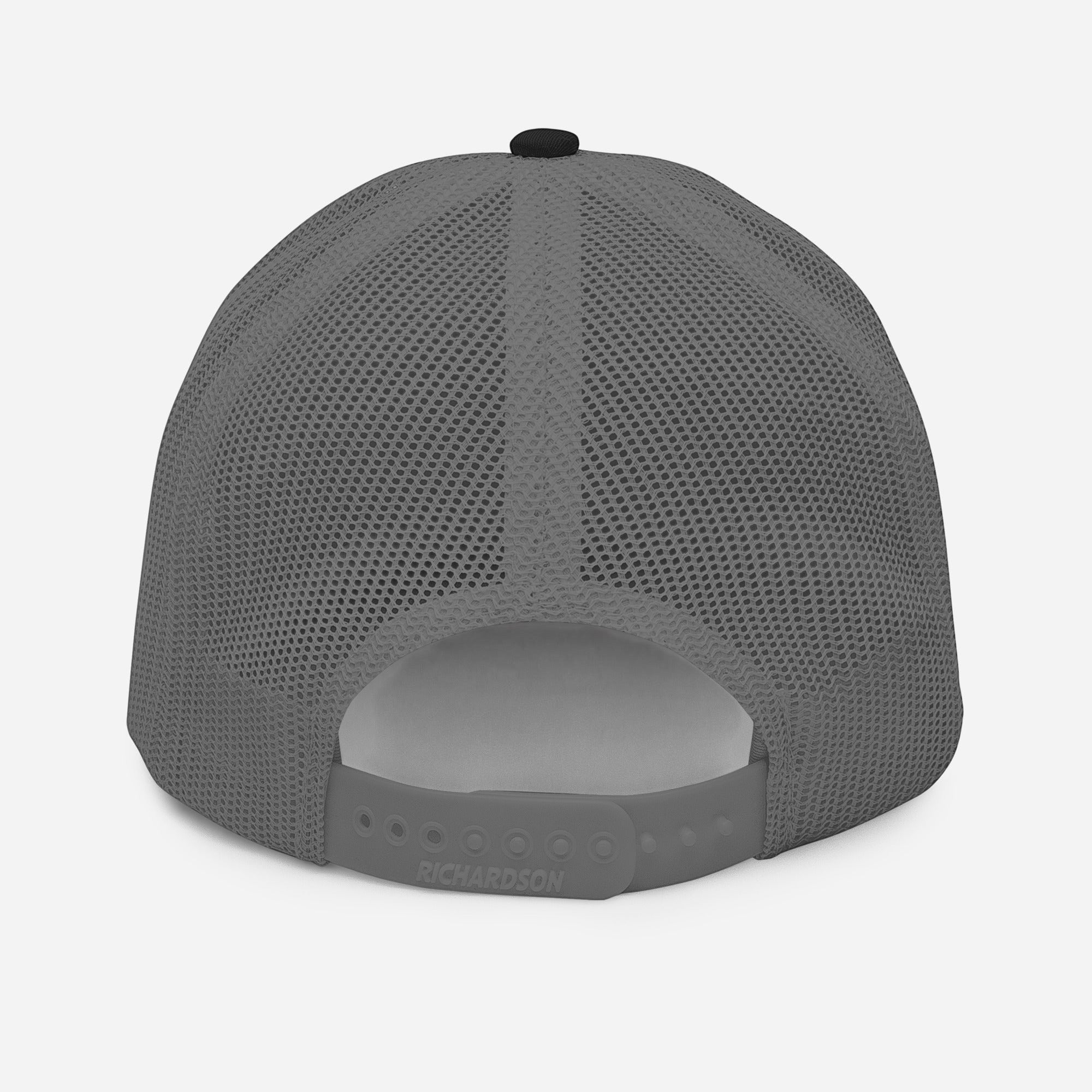 Stylio grey trucker cap with black top button and mesh back. Features adjustable snapback closure.