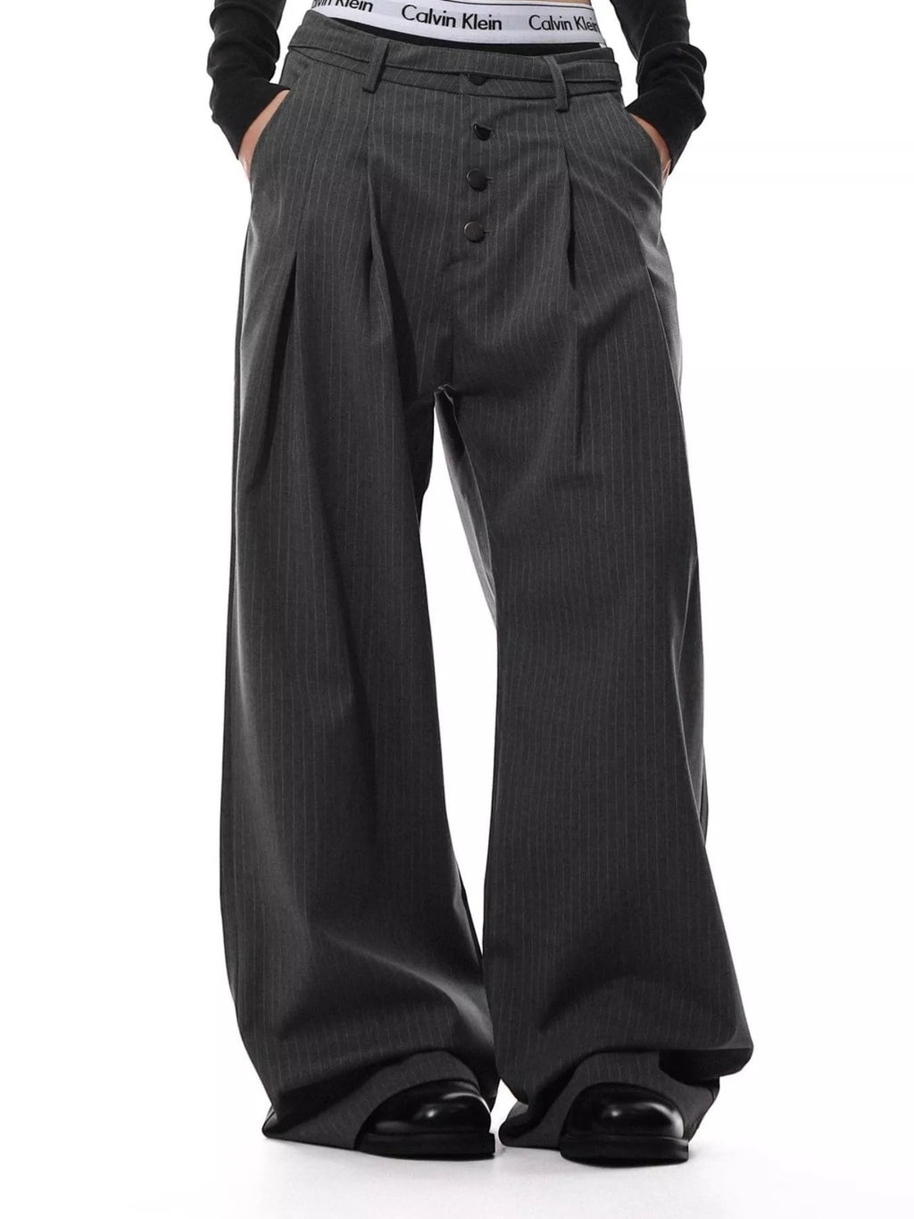 Stylio men's charcoal grey pinstripe wide-leg pants with button-front closure and pockets. Polyester-spandex blend.
