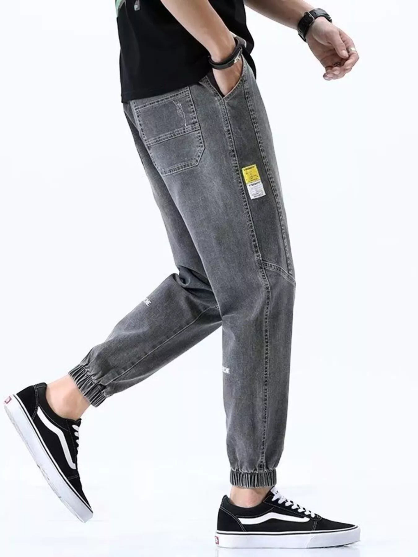 Stylio men's grey washed 100% cotton loose fit drawstring jeans with elastic cuffs and pockets.