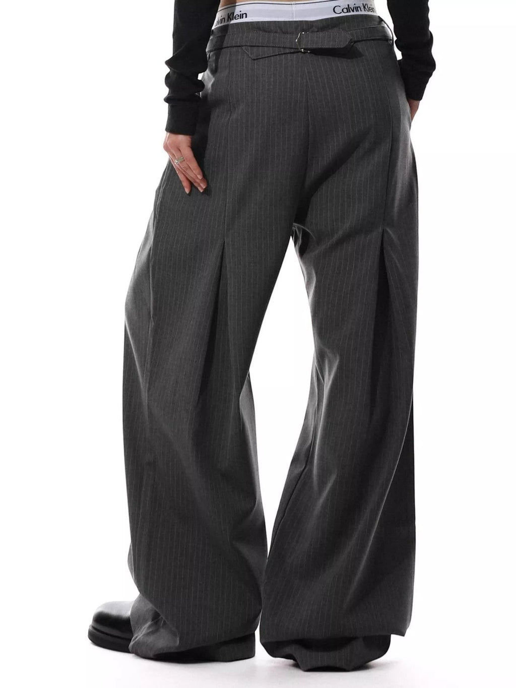 Stylio men's dark grey pinstripe wide-leg pants with button-front closure and pockets. Polyester-spandex blend.