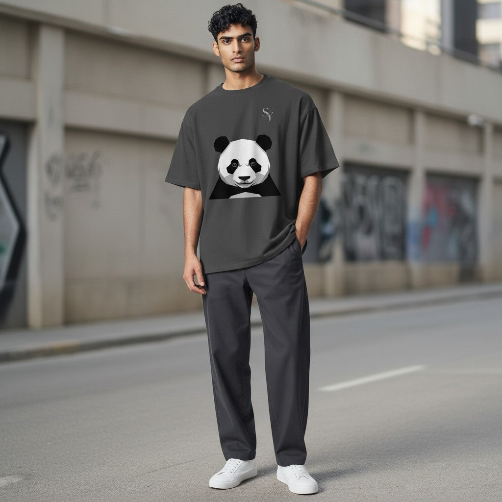Stylio oversized faded charcoal t-shirt with a geometric panda graphic and a subtle brand logo.