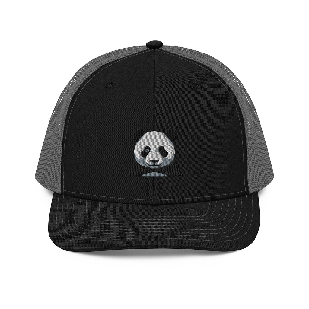 Stylio black trucker cap with grey mesh back and embroidered panda face on front panel. Adjustable snapback closure.