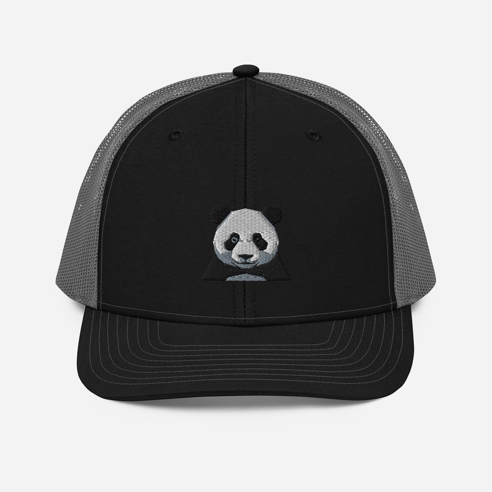 Stylio black trucker cap with grey mesh back and embroidered panda face graphic on front panel.