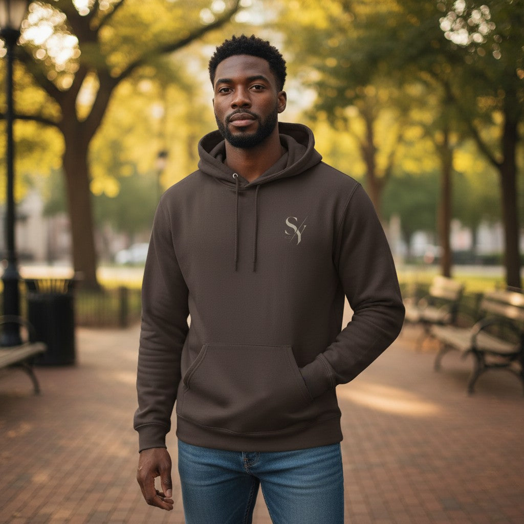 Stylio SY Monogram Hoodie in Safari brown, made from 8 oz. NuBlend fleece with a pouch pocket and double-ply hood.