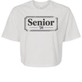 Stylio white 100% cotton crop tee with "Senior '26" graphic print. Relaxed fit, oversized sleeves, and mid-length hem.