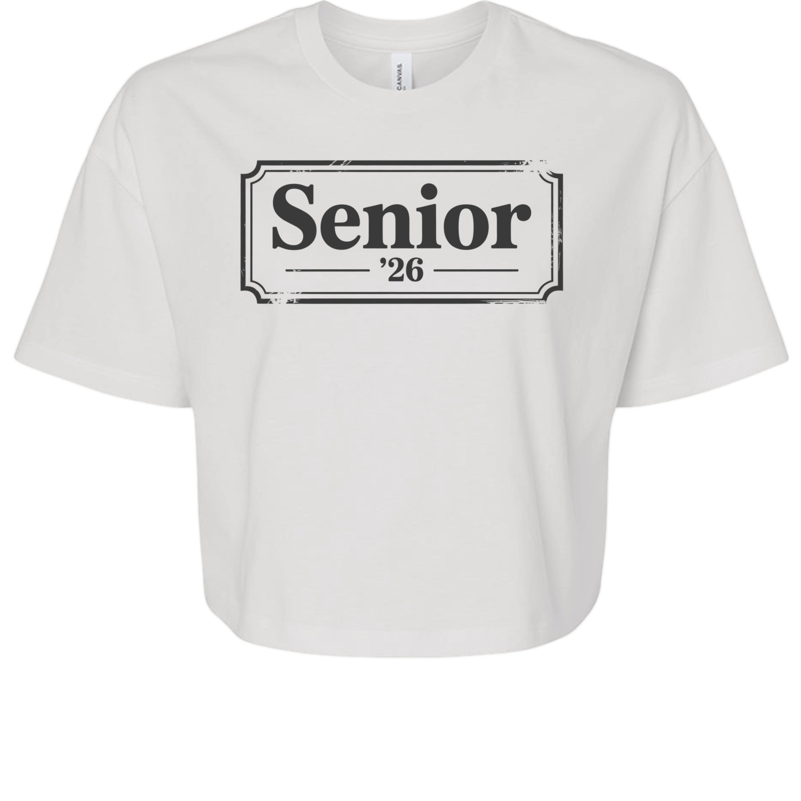 Stylio white 100% cotton crop tee with "Senior '26" graphic print. Relaxed fit, oversized sleeves, and mid-length hem.