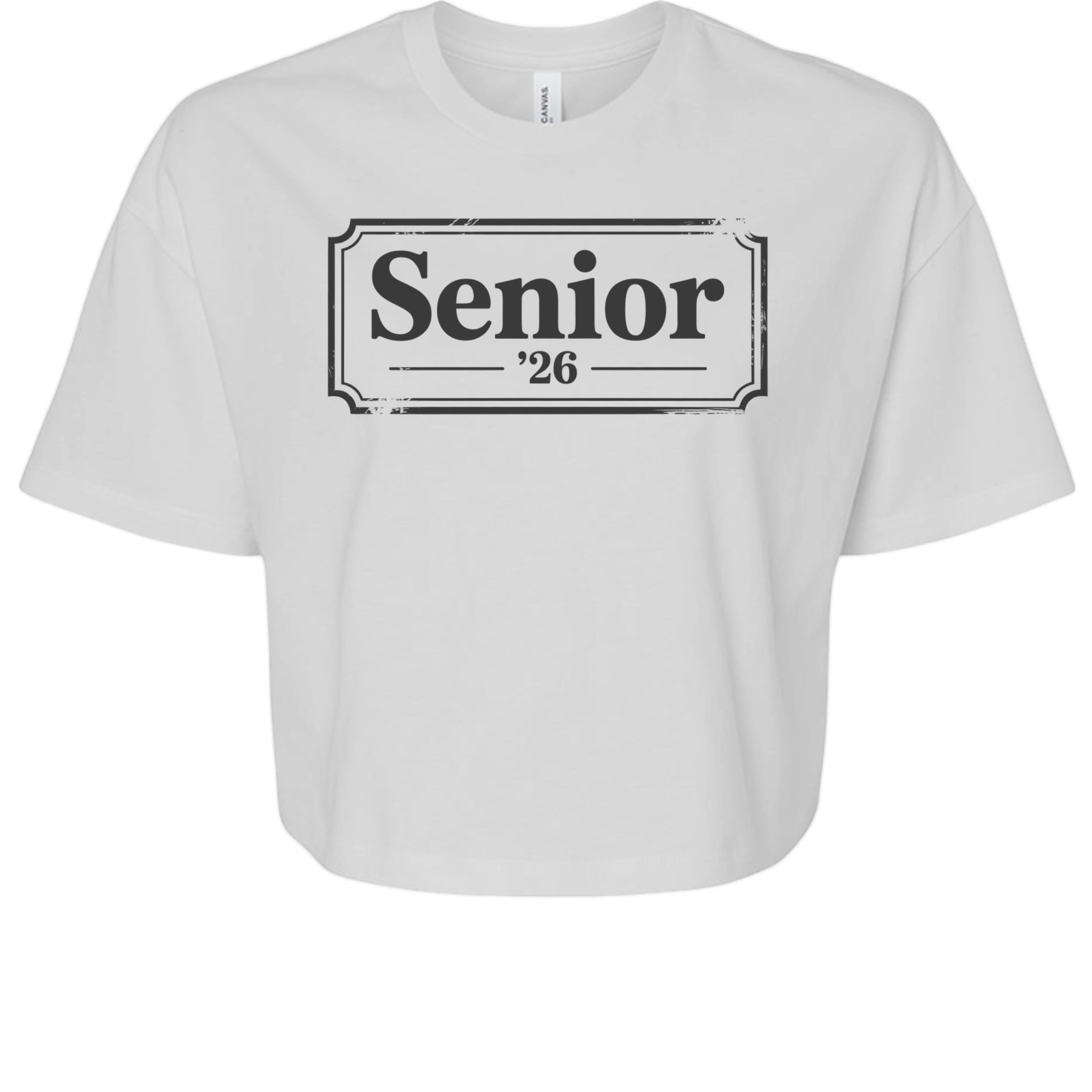 Stylio white 100% cotton crop tee with "Senior '26" graphic print on front. Relaxed fit, crew neck, and short sleeves.