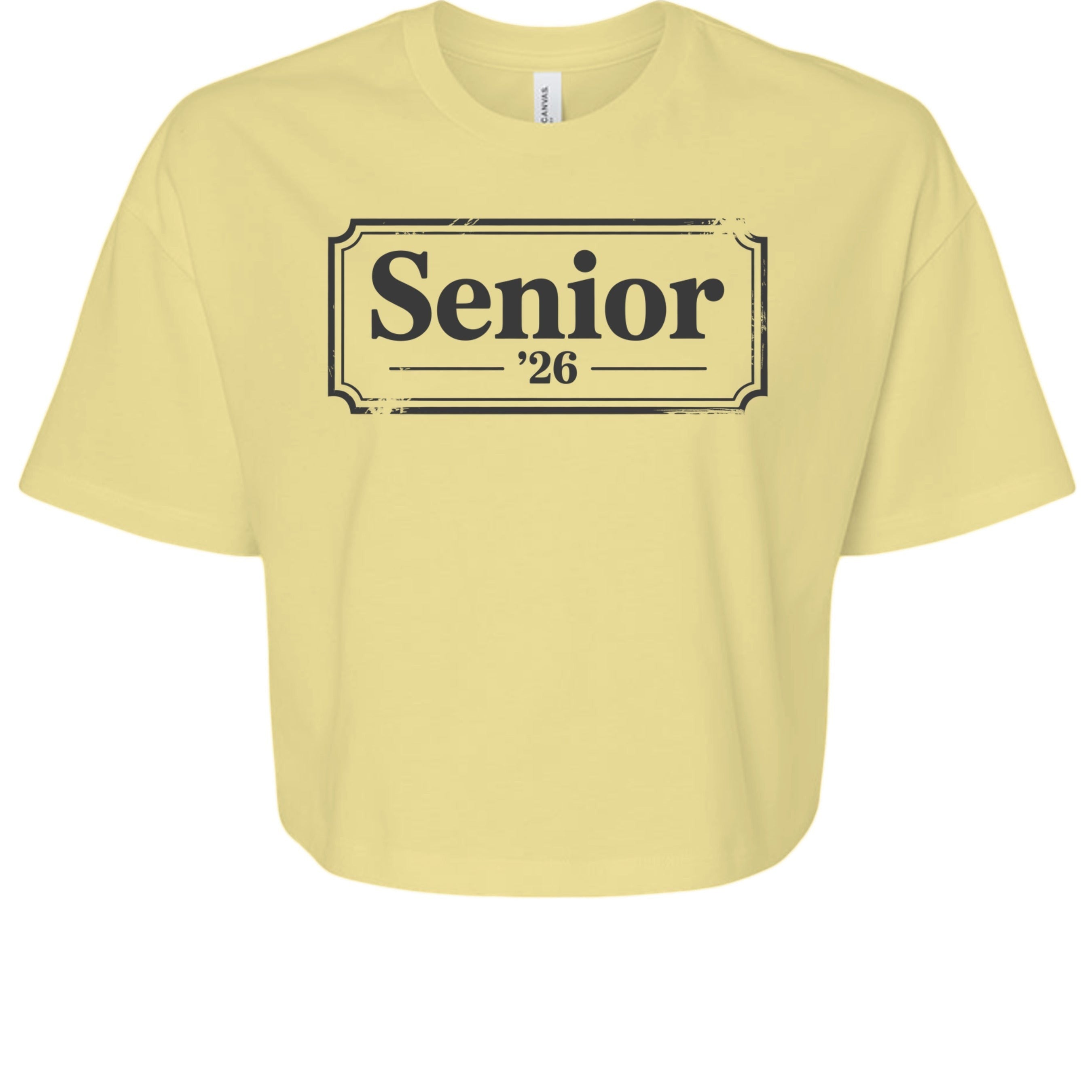 Stylio Women's pale yellow crop tee with "Senior '26" graphic print. 100% cotton, relaxed fit.