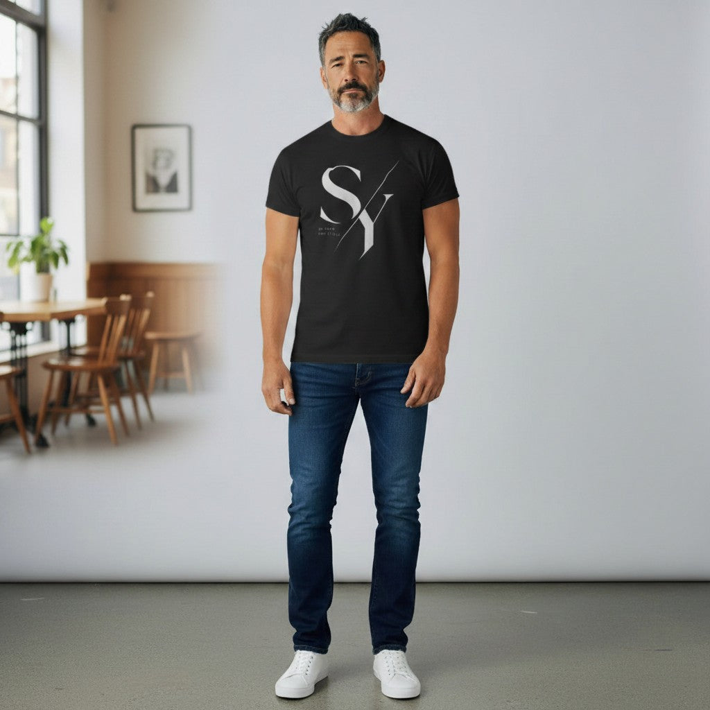 Stylio x Under Armour black short-sleeve tee with white SY logo and text. Model is smiling, wearing the shirt with hands in pockets.