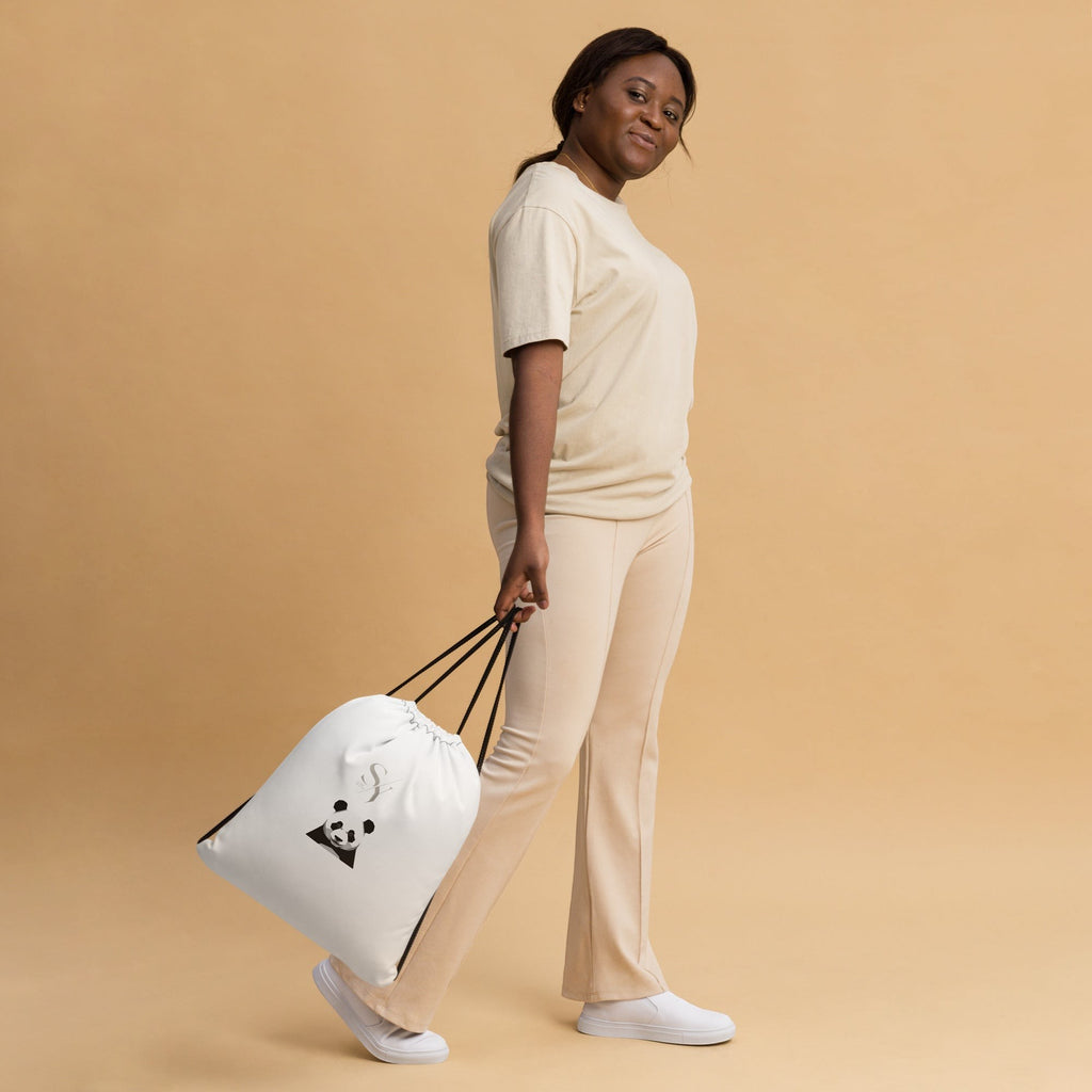 Stylio white polyester drawstring gym bag with black straps and a panda graphic, worn by a model.