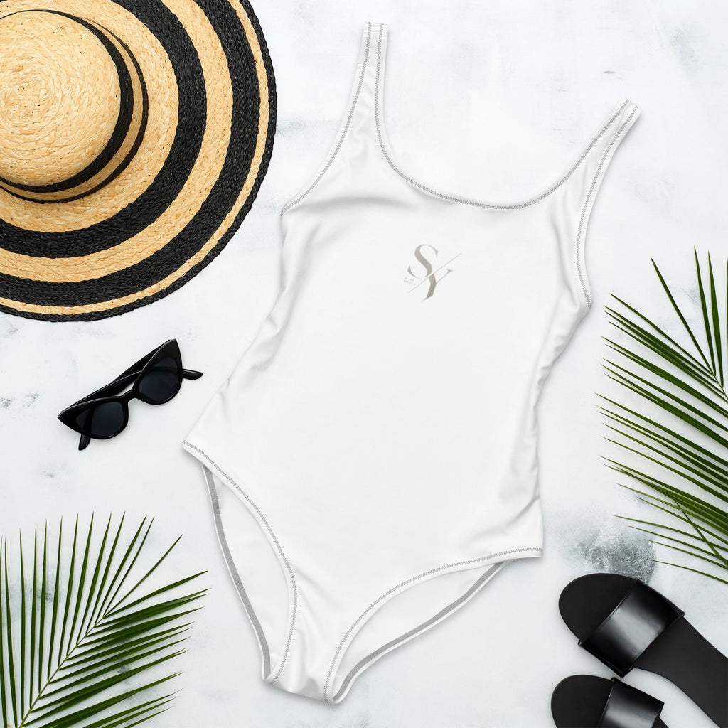 Stylio white one-piece swimsuit with scoop neckline and low scoop back, made from recycled polyester and elastane.