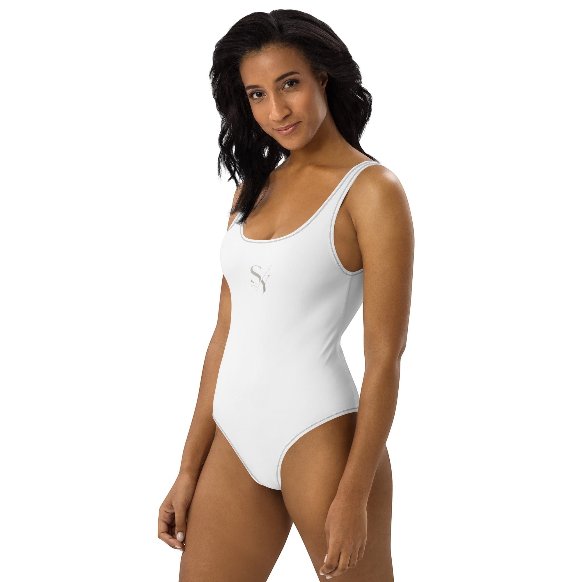 Stylio white one-piece swimsuit with scoop neckline, low scoop back, and cheeky fit. Made from recycled polyester and elastane.