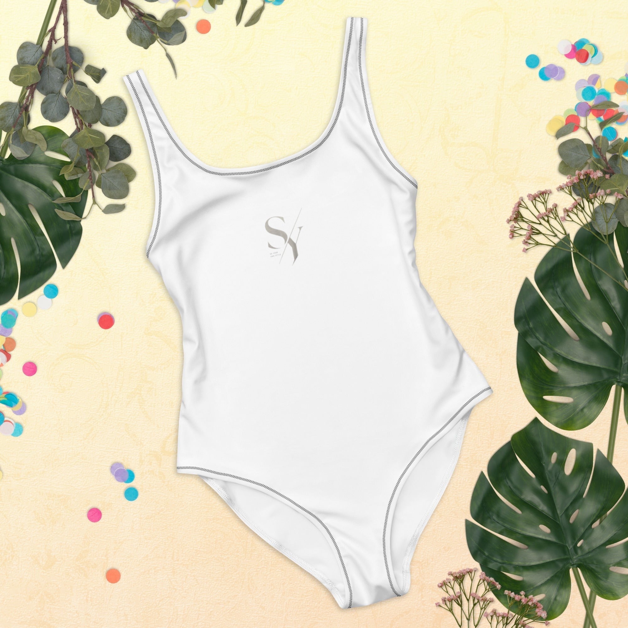 Stylio white one-piece swimsuit with scoop neckline and low scoop back, made from recycled polyester and elastane.