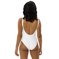 Stylio white one-piece swimsuit with a low scoop back and cheeky fit, made from recycled polyester and elastane.