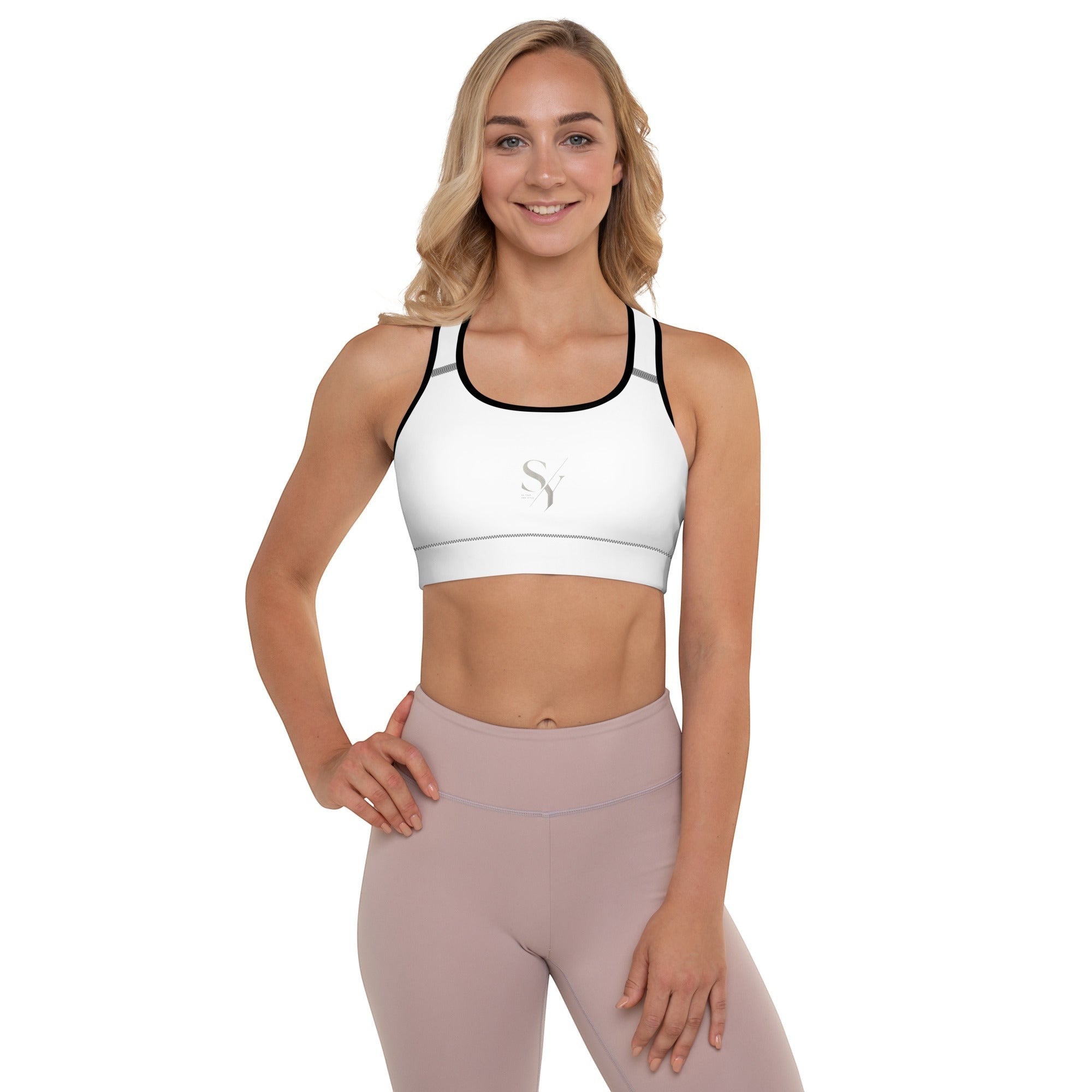 Stylio white padded sports bra with scoop neckline, racerback, and removable padding. Moisture-wicking fabric for maximum support.