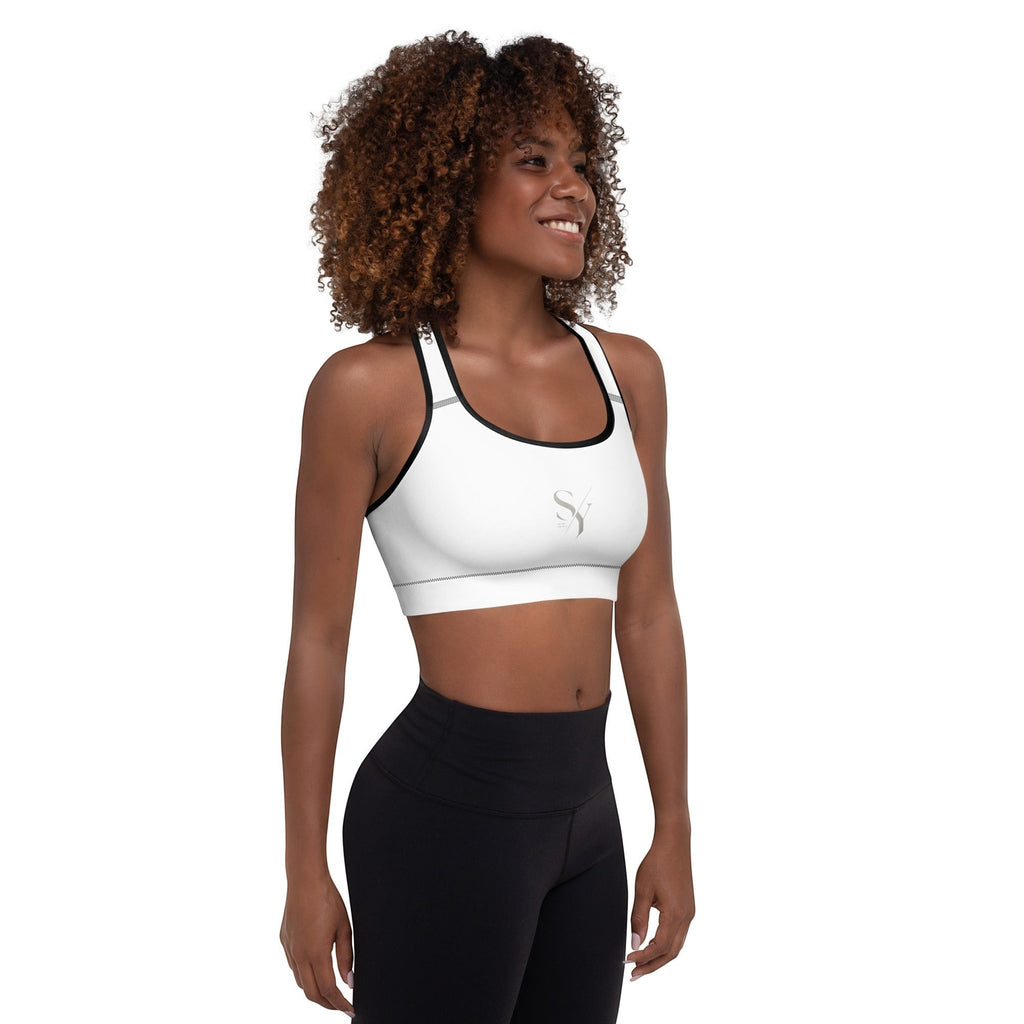 Stylio white padded sports bra with scoop neckline, racerback, and removable padding. Moisture-wicking fabric for maximum support.