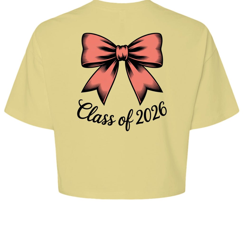 Stylio yellow 100% cotton crop tee with a pink bow graphic and "Class of 2026" text.